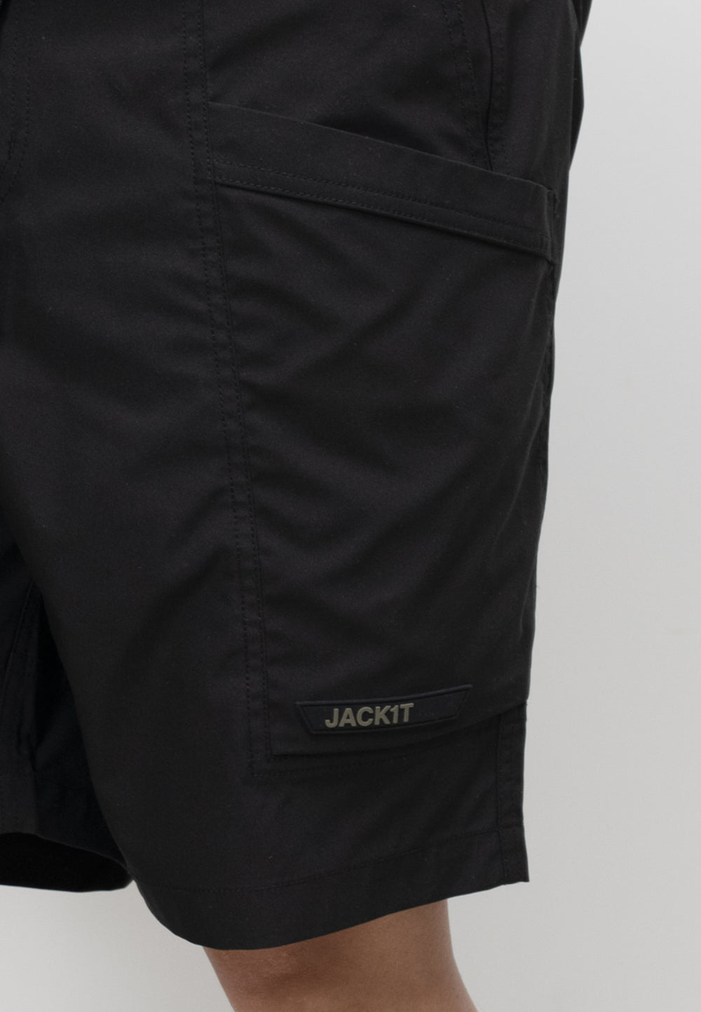 men's black summer shorts with pockets and JACKIT label, designed for lightweight comfort and relaxed fit.