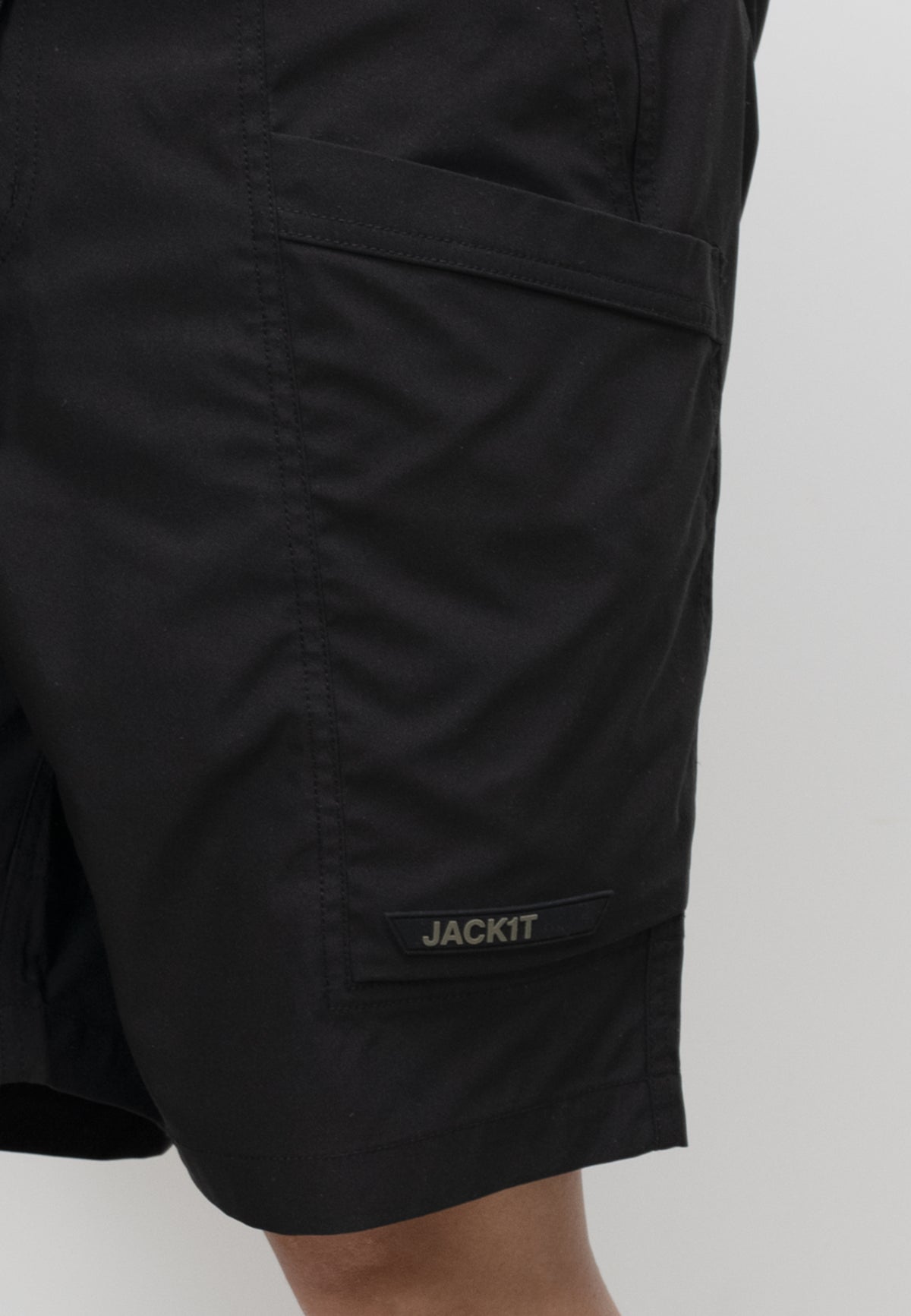 men's black summer shorts with pockets and JACKIT label, designed for lightweight comfort and relaxed fit.