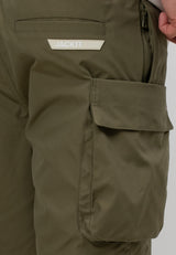 Close-up of men's olive cargo shorts featuring a utility pocket and brand logo for style and functionality.