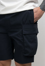 Men's navy cargo shorts showcasing utility pockets and a relaxed fit, perfect for summer activities.
