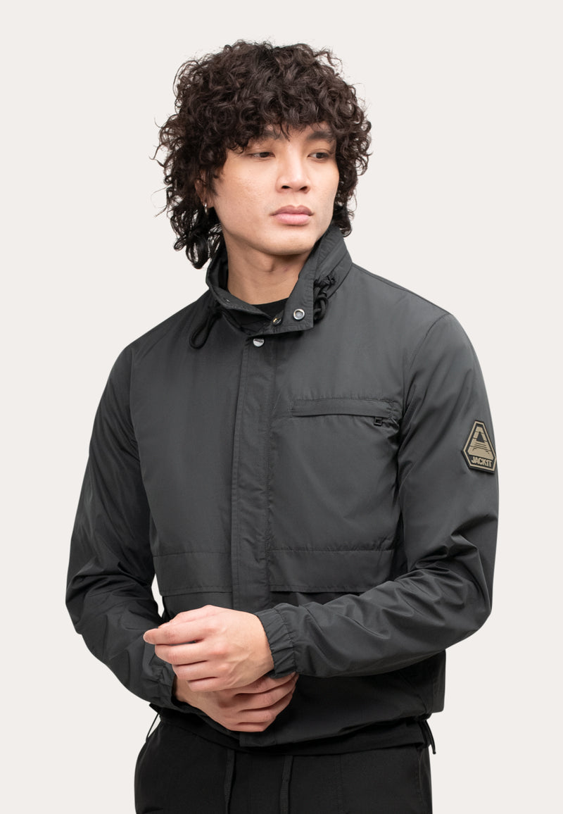 Mens Lightweight Black Windbreaker on a model with curly hair showcasing the stylish design and features.