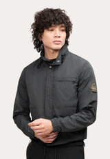 Mens Lightweight Black Windbreaker on a model with curly hair showcasing the stylish design and features.