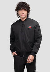Model wearing Oberon Tech Mens black bomber jacket with lightweight water-resistant fabric and zip pockets.