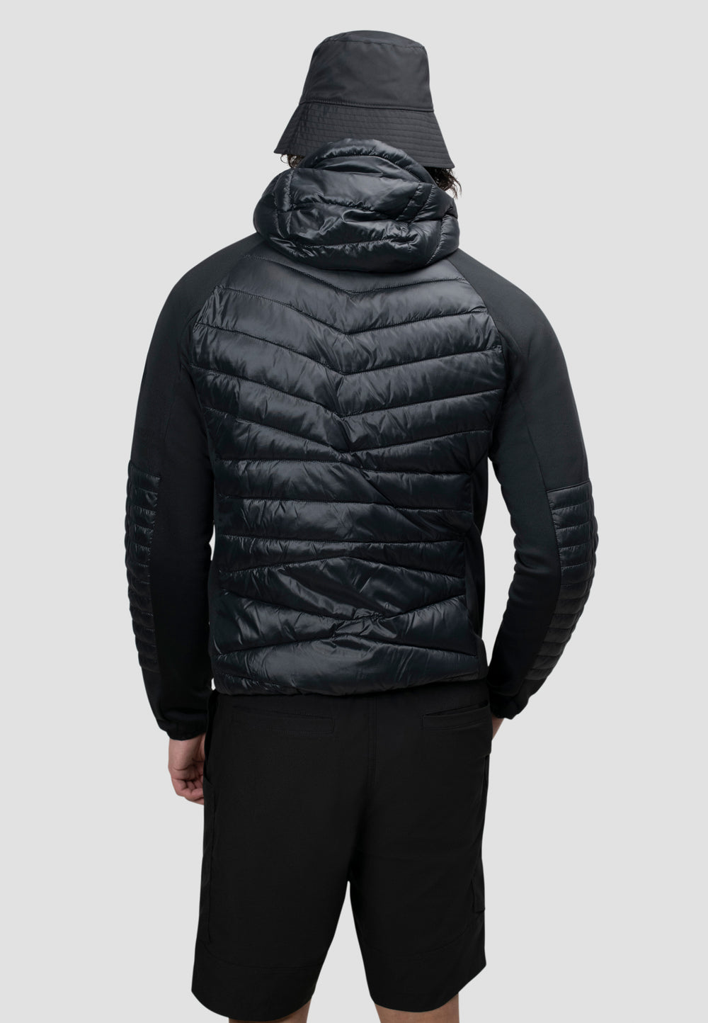 Men's black hooded jacket back view showcasing lightweight and water-resistant design.