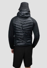 Back view of a man wearing the Mens Hybrid Black Hooded Jacket, showcasing the lightweight design and non-removable hood.