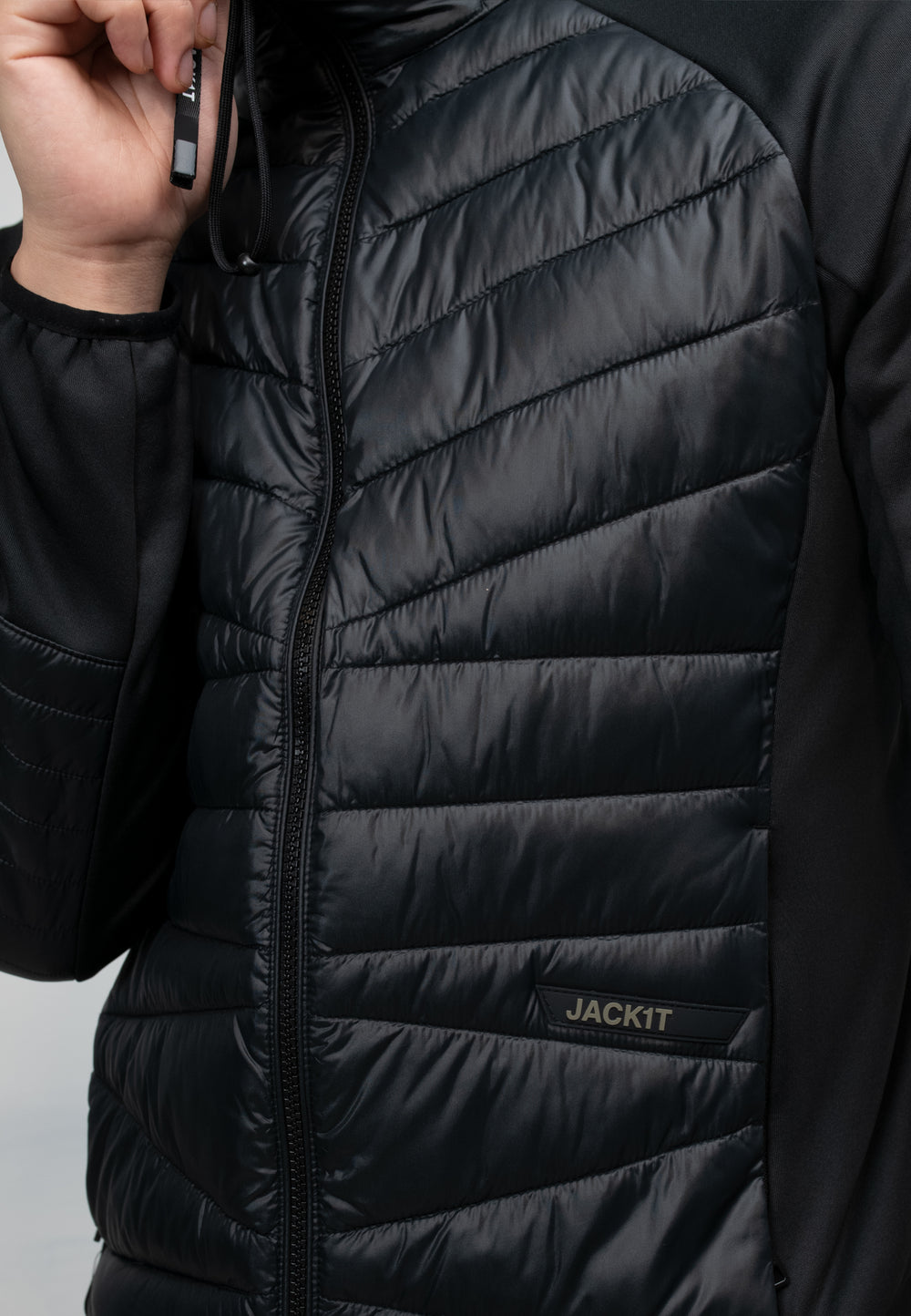 Men's black hooded jacket with THERMOLITE insulation and water-resistant features.