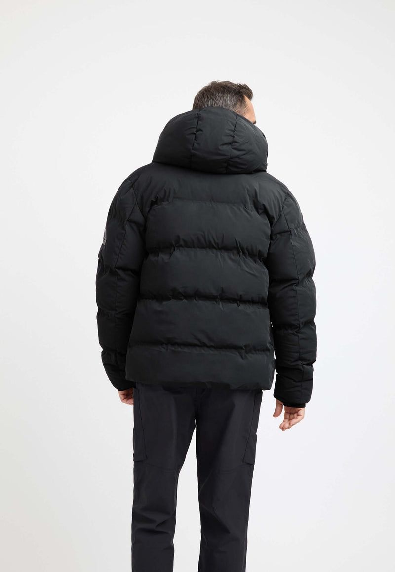 Back view of a man wearing a mens puffer jacket black with a hood, perfect for winter outerwear.