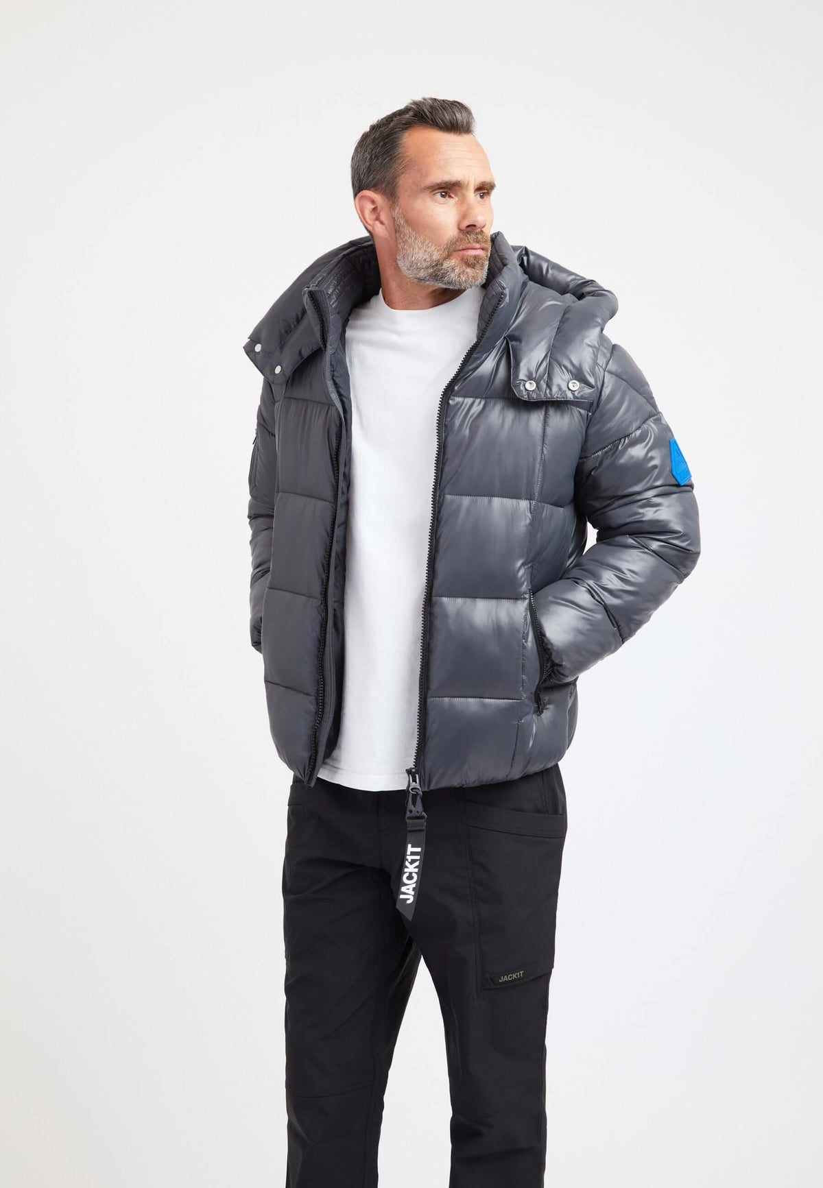 Mens grey racer jacket worn by a model, styled with a white shirt and black pants.