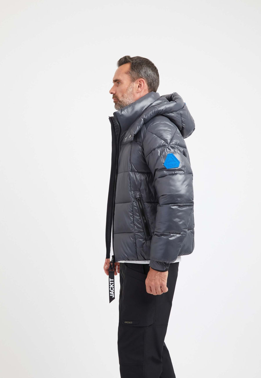 Mens grey racer jacket displayed on a model showing side profile with hood and blue patch, highlighting premium insulation.