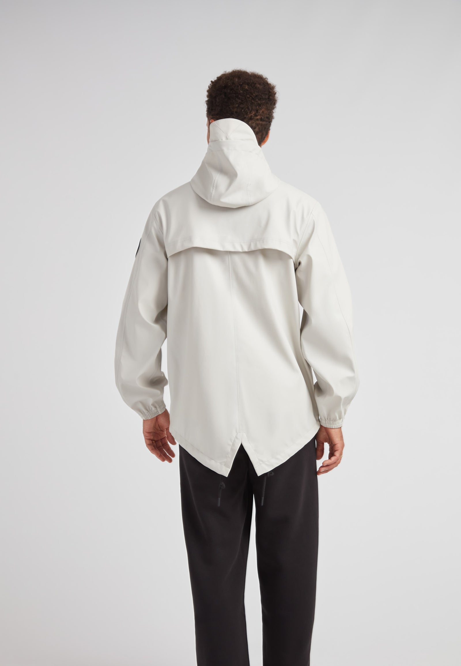 Back view of ELEMENTS Unisex Raincoat 2.0 Stone, showcasing its stylish design and practical features.
