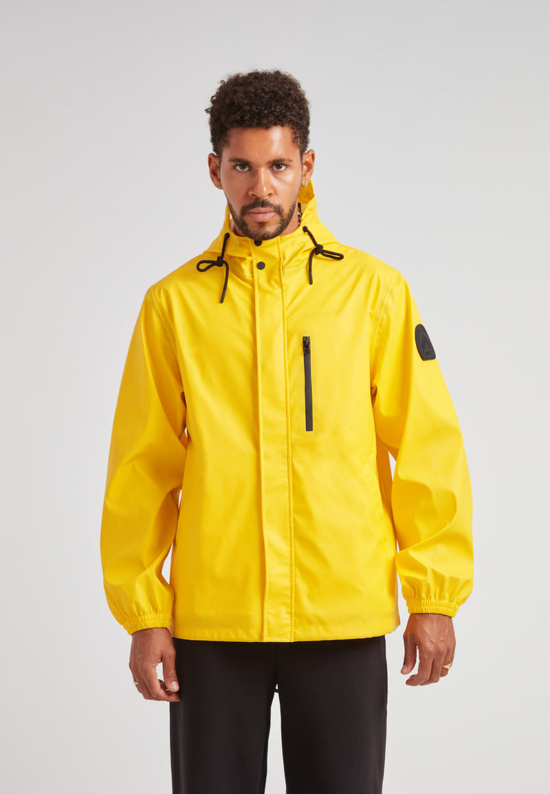 ELEMENTS Unisex Raincoat 2.0 Yellow worn by a man, showcasing its bright yellow color and stylish design.