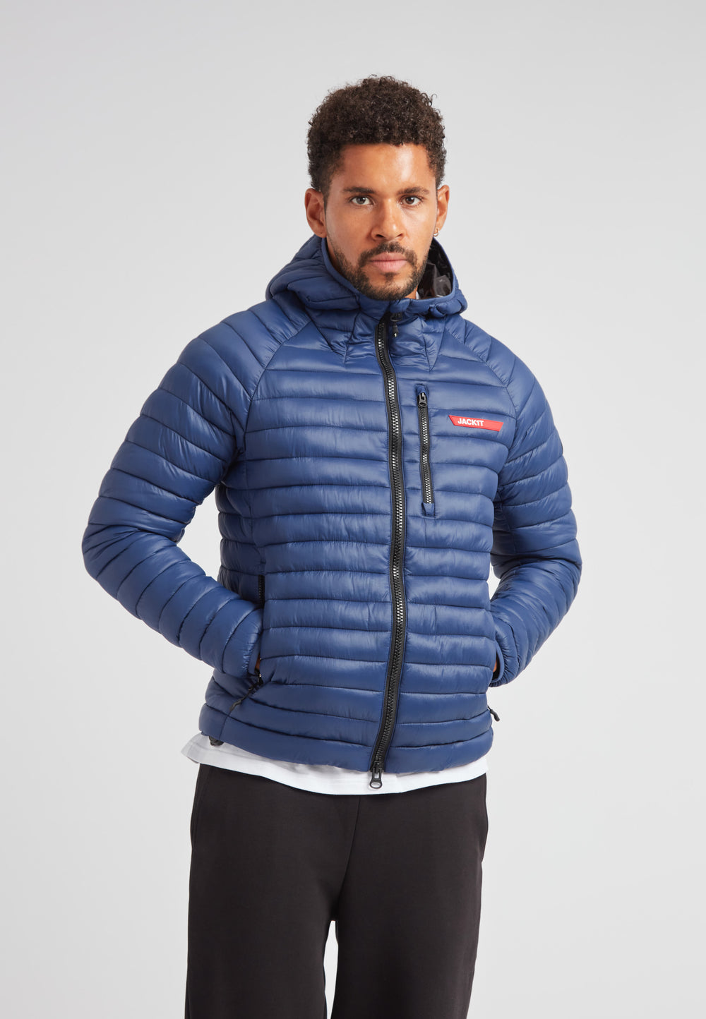SATEL1TE hooded jacket 2.0 pacific blue worn by a model, showcasing its stylish design and performance features.