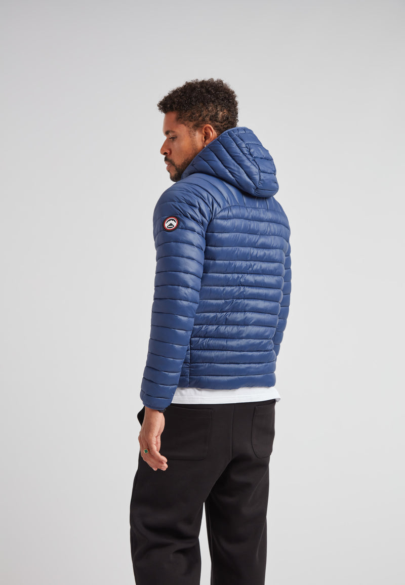 Man wearing SATEL1TE hooded jacket 2.0 pacific blue, featuring a compact and stylish design.