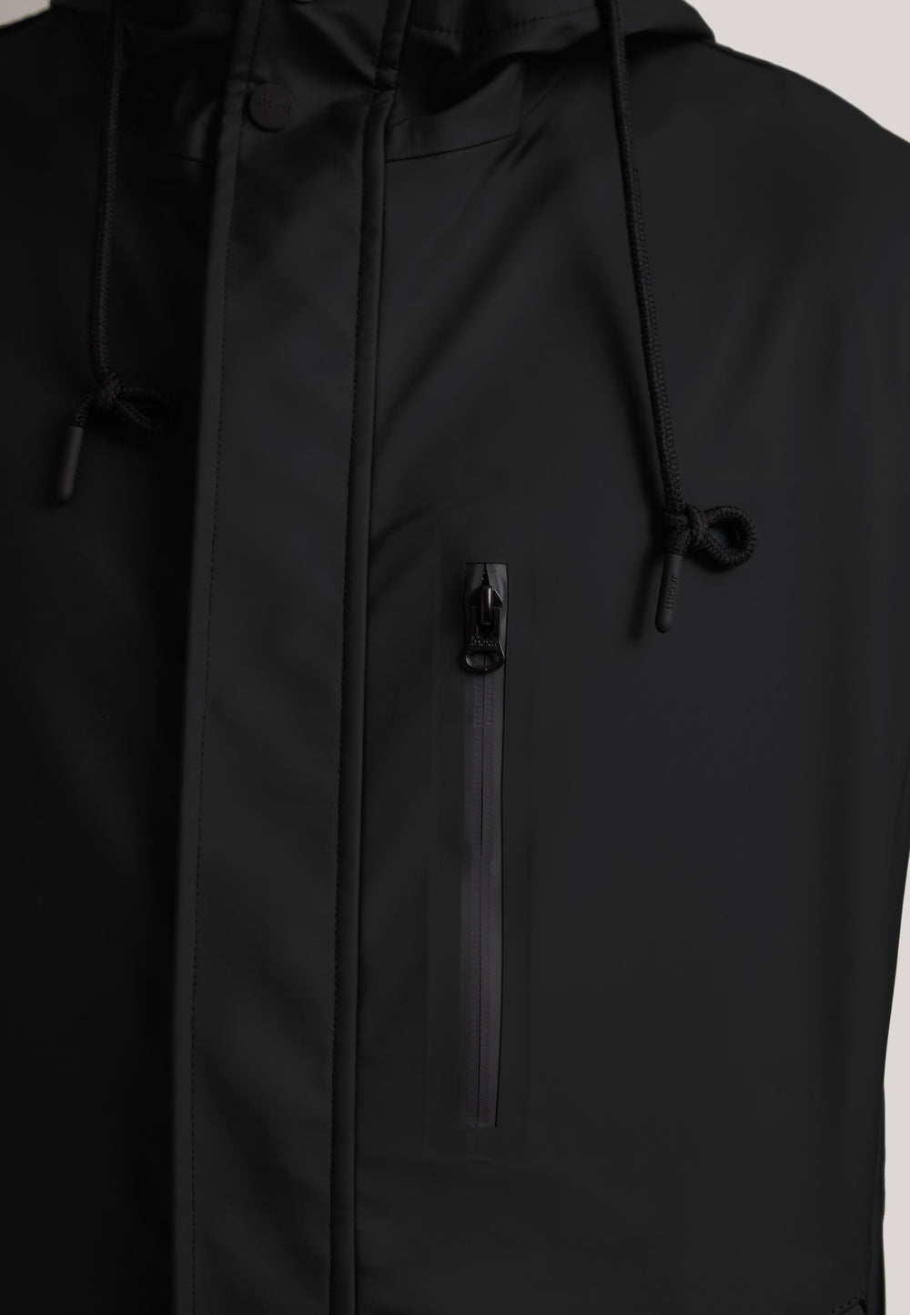 ELEMENTS Unisex Raincoat 2.0 Black close-up of the zipper and hood details.