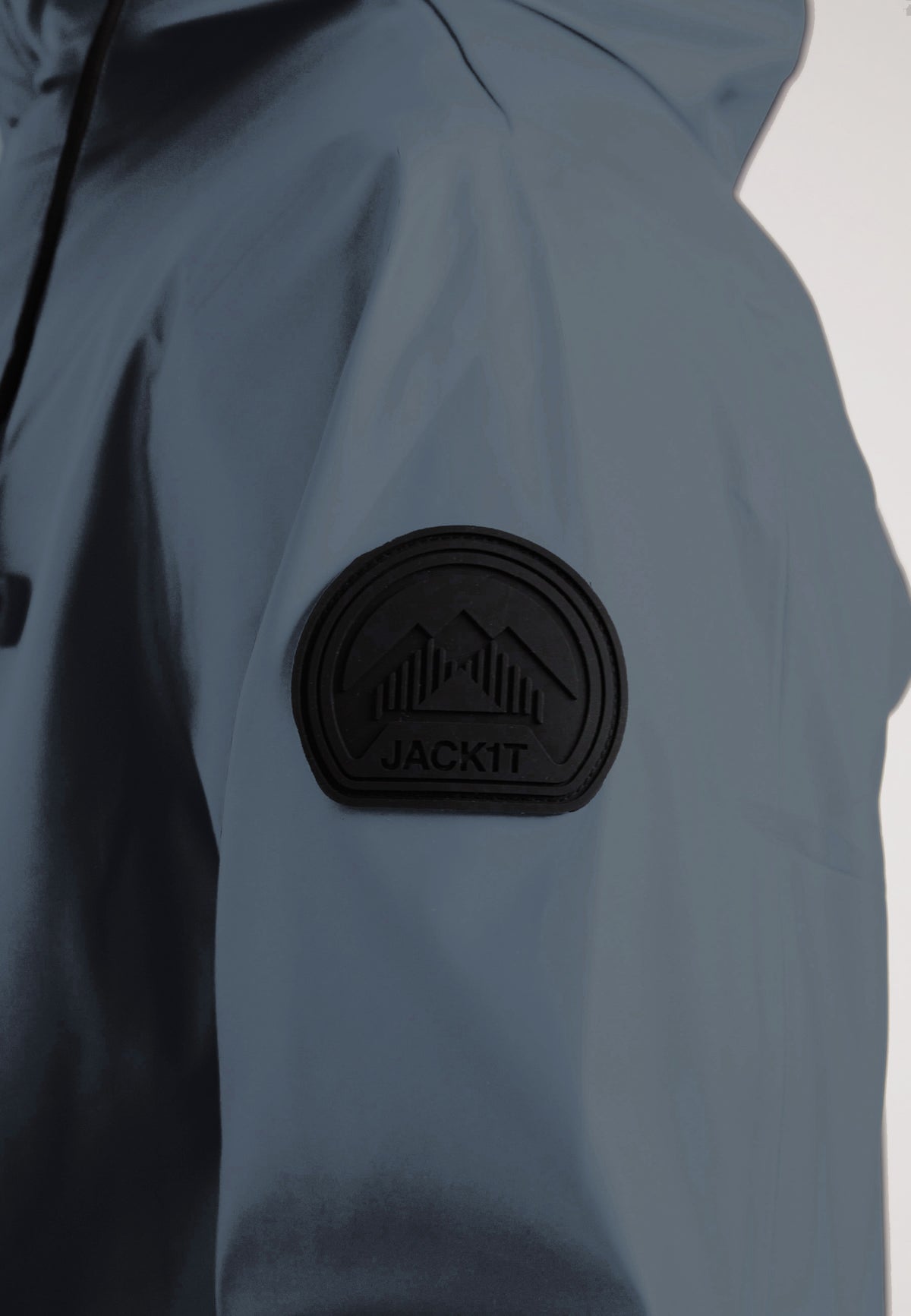 Close-up of the shoulder logo on the ELEMENTS Unisex Raincoat 2.0 Grey by JACK1T.
