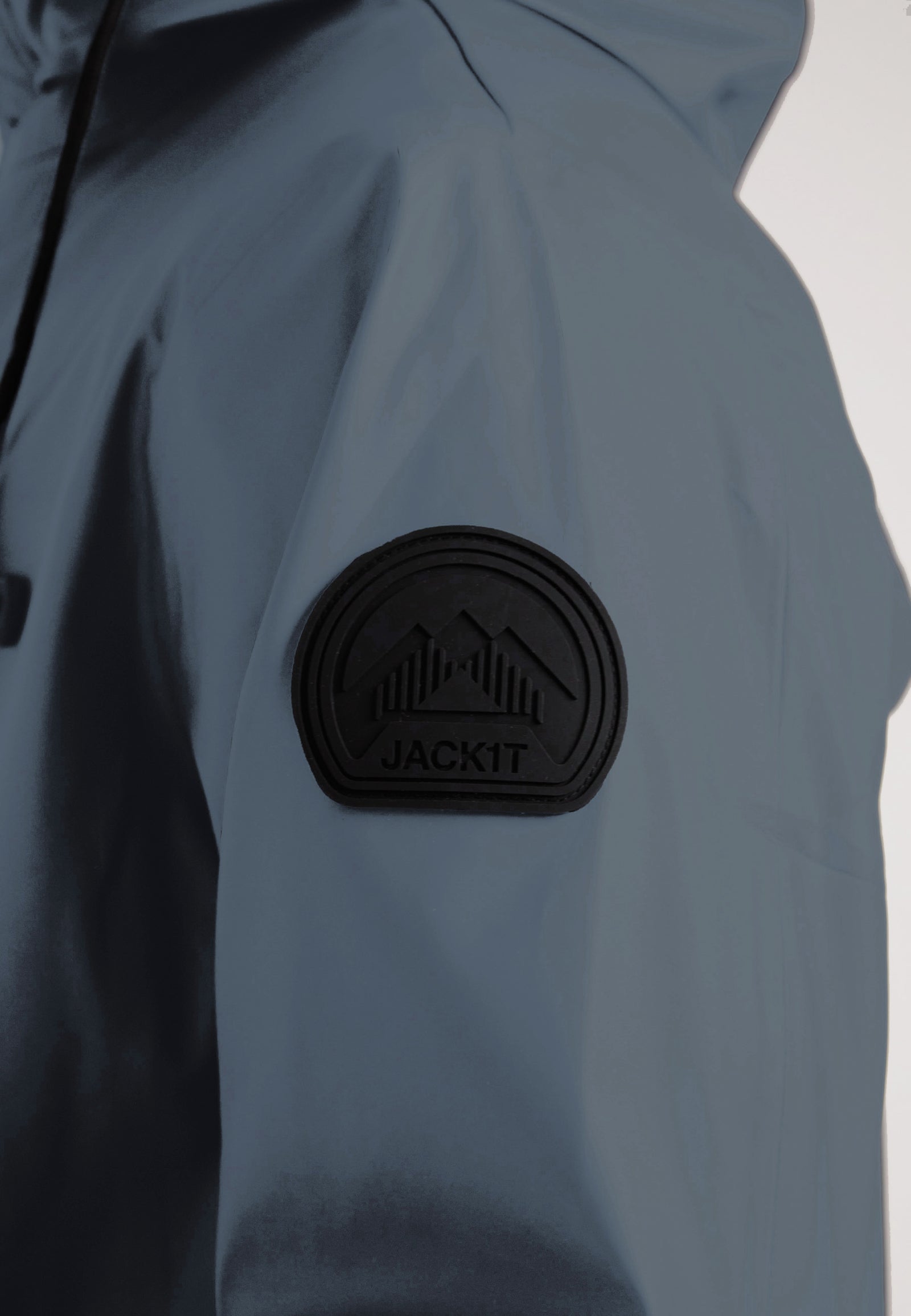 Close-up of the shoulder logo on the ELEMENTS Unisex Raincoat 2.0 Grey by JACK1T.