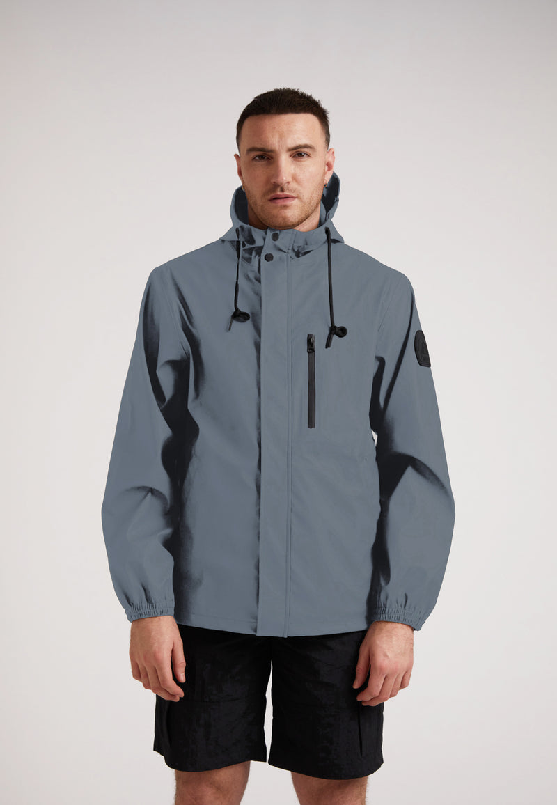ELEMENTS Unisex Raincoat 2.0 Grey worn by a model, showcasing its lightweight and waterproof design.