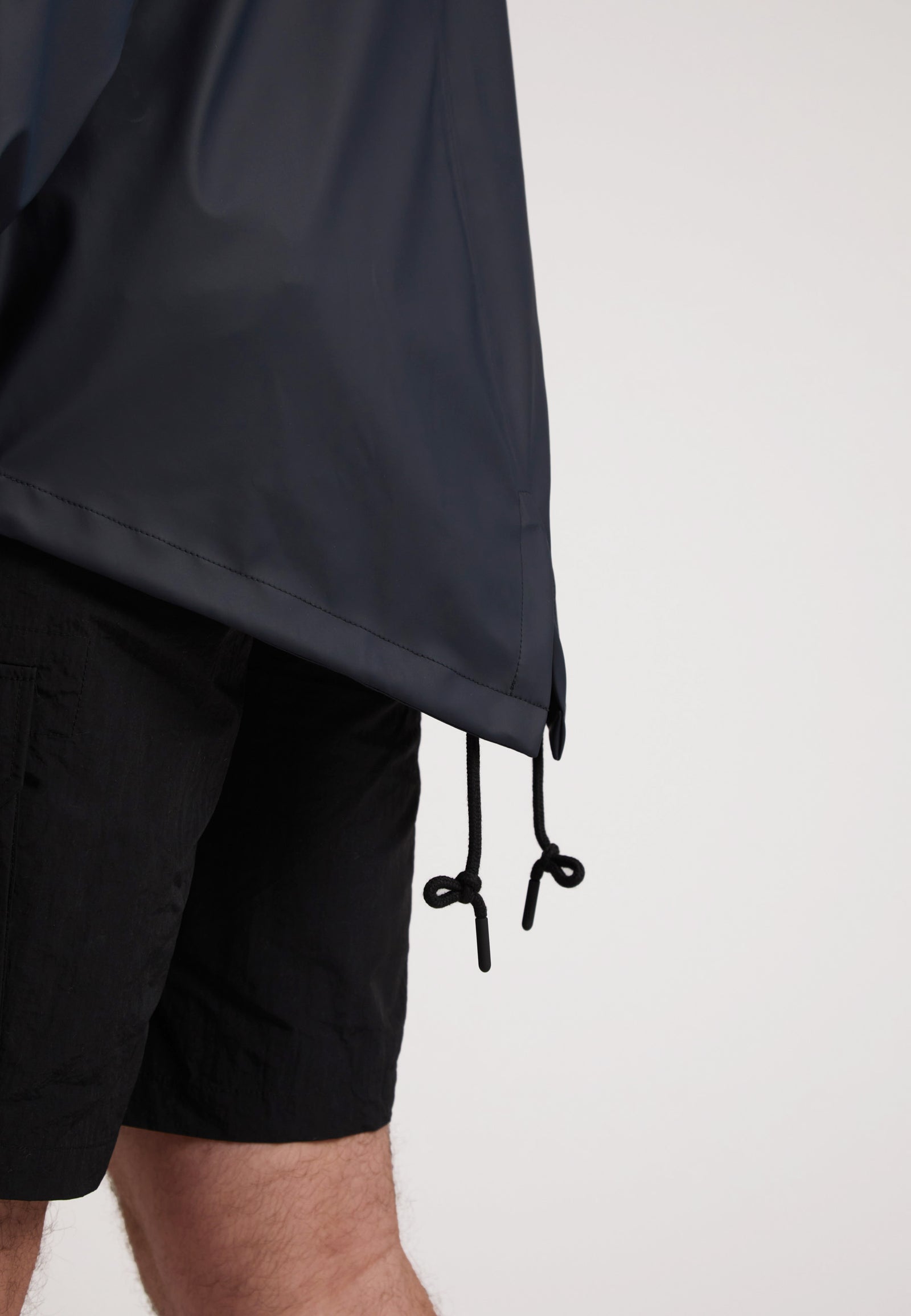 ELEMENTS Unisex Raincoat 2.0 Navy showing adjustable drawstrings and lightweight fabric detail.