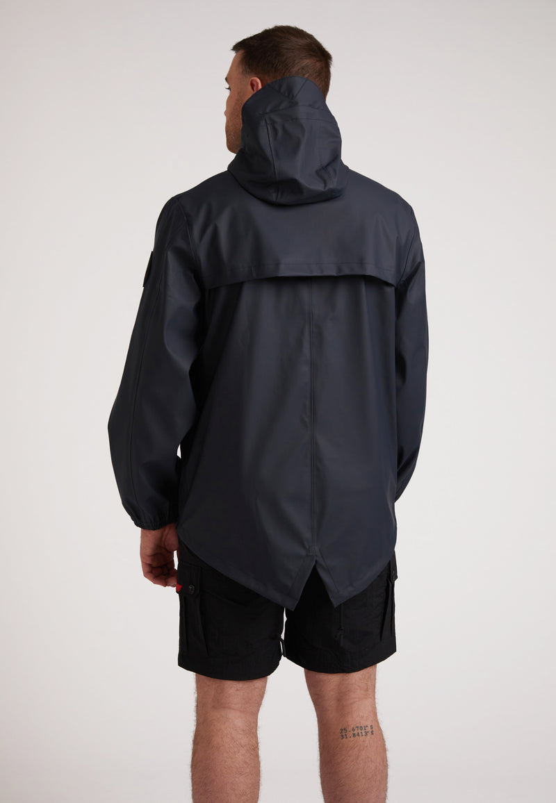 Back view of a man wearing the ELEMENTS Unisex Raincoat 2.0 Navy, showcasing its stylish design and functionality.
