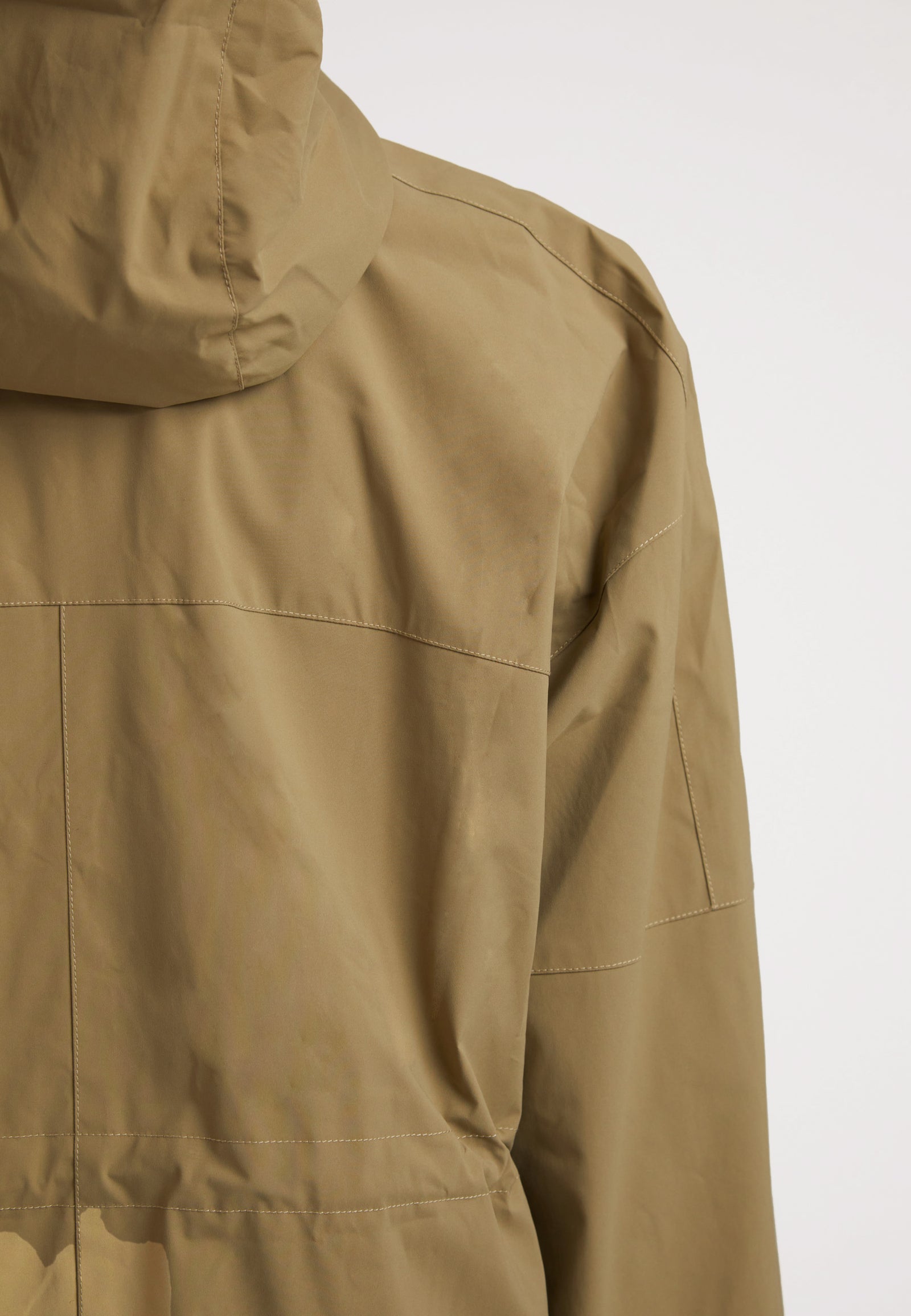 Back view of the ISOTOPE Ladies lightweight olive windbreaker featuring a hood and durable fabric.