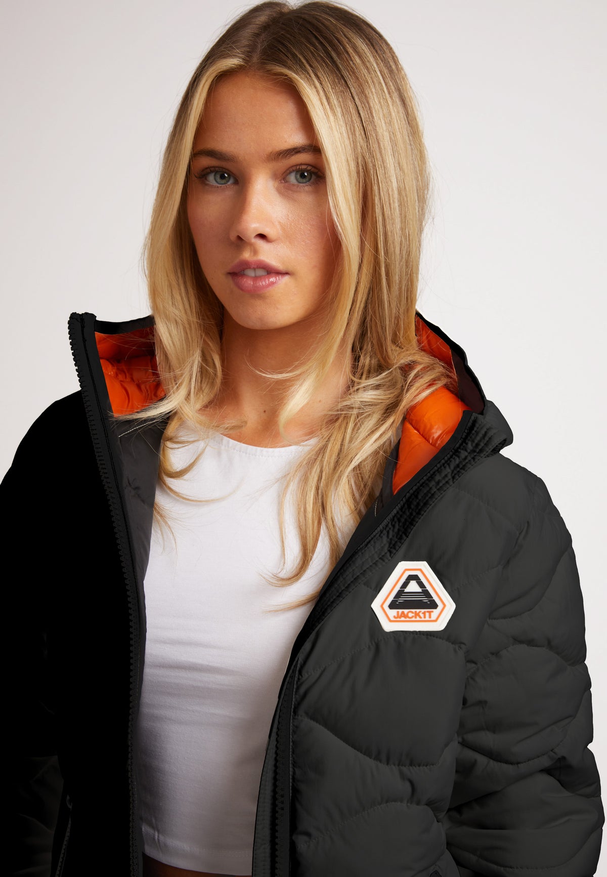Model wearing ORB1T Quilted Puffer Jacket featuring onion baffle and contrast hood color.