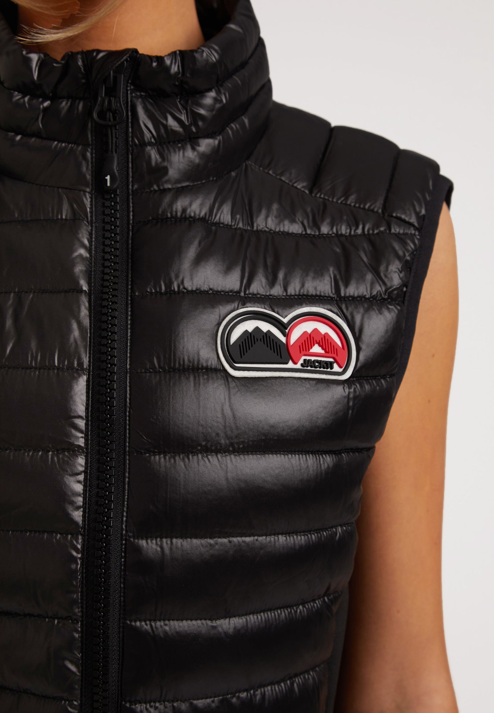 SPORTL1TE Funnel Lightweight Gilet 2.0 Lux Black featuring sleek black design and logo detail on the chest.