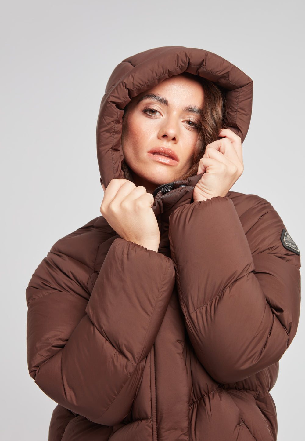 Ladies Cloud Crop Down Puffer Jacket in Mid Brown with oversized hood, quilted design, and stylish fit.