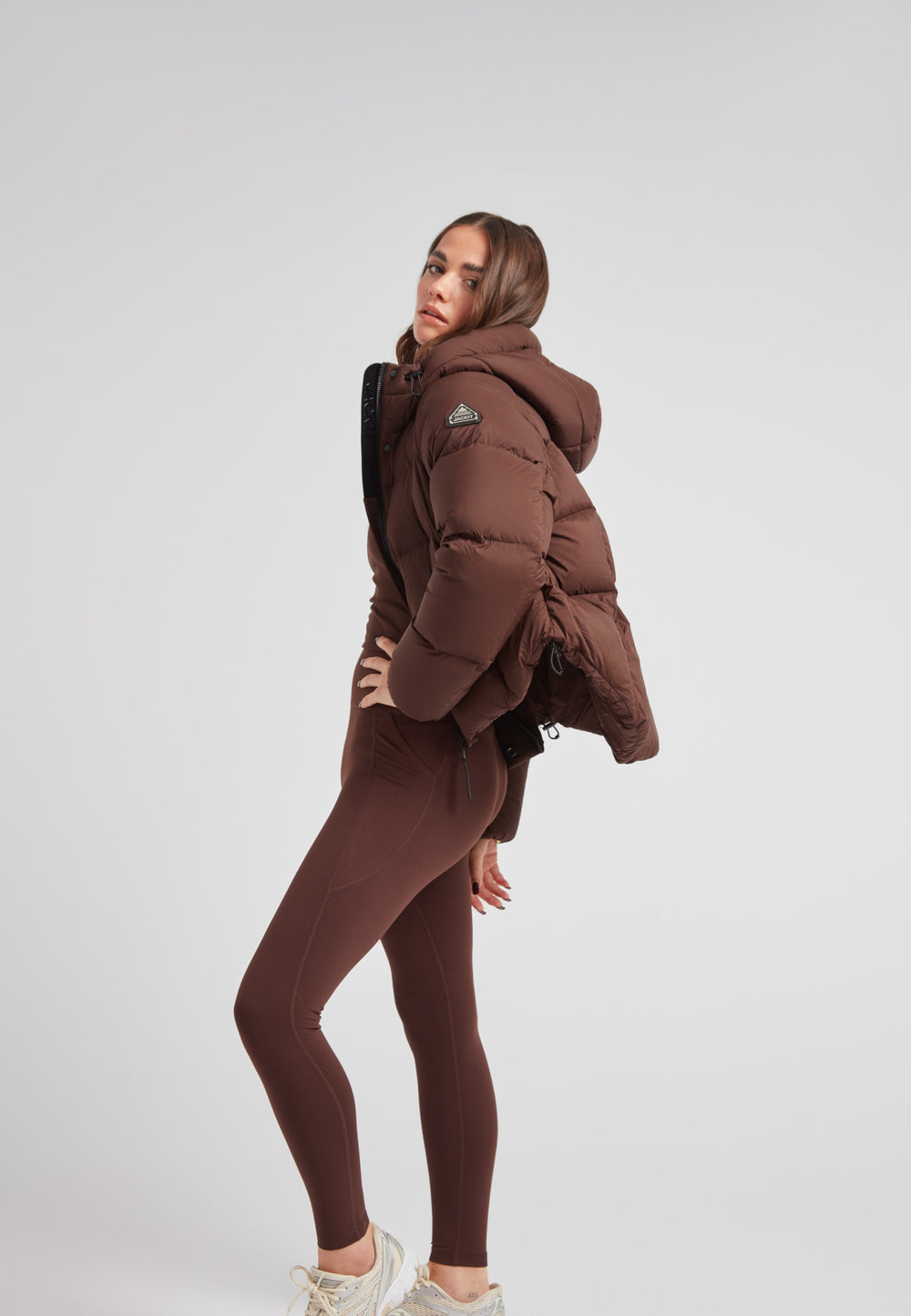 Ladies Cloud Crop Down Puffer Jacket in Mid Brown worn with matching leggings on a model in a studio setting.