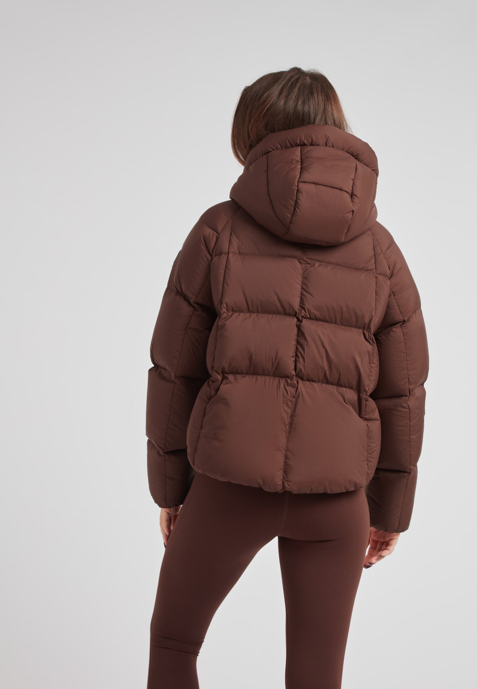 Ladies Cloud Crop Down Puffer Jacket in Mid Brown showcased from the back, featuring oversized hood and modern silhouette.