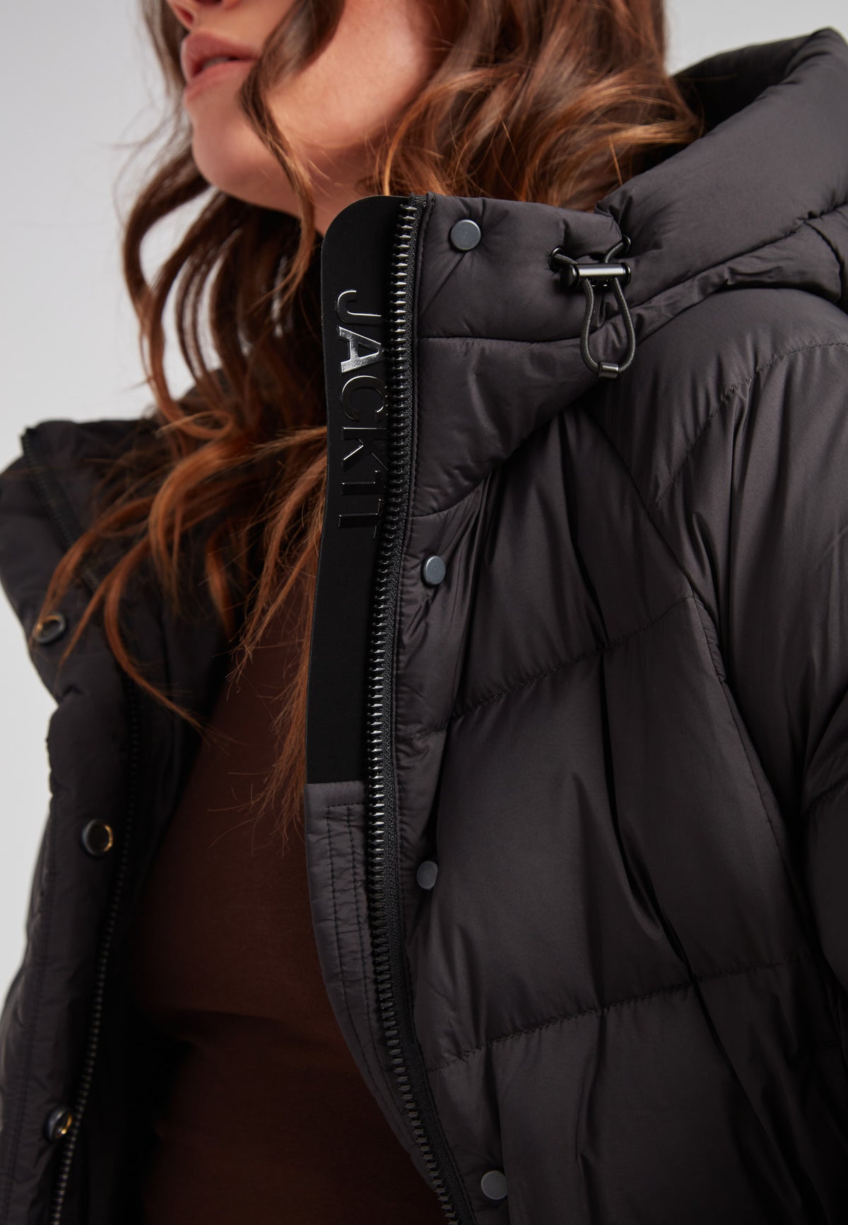 Close-up of the Cloud Crop Down Puffer Jacket Black showcasing its oversized hood and lightweight construction.