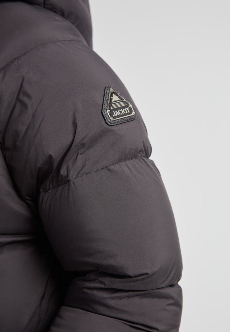 Close-up of the JACK1T logo on the sleeve of the Cloud Prime Longline Down Puffer Jacket.