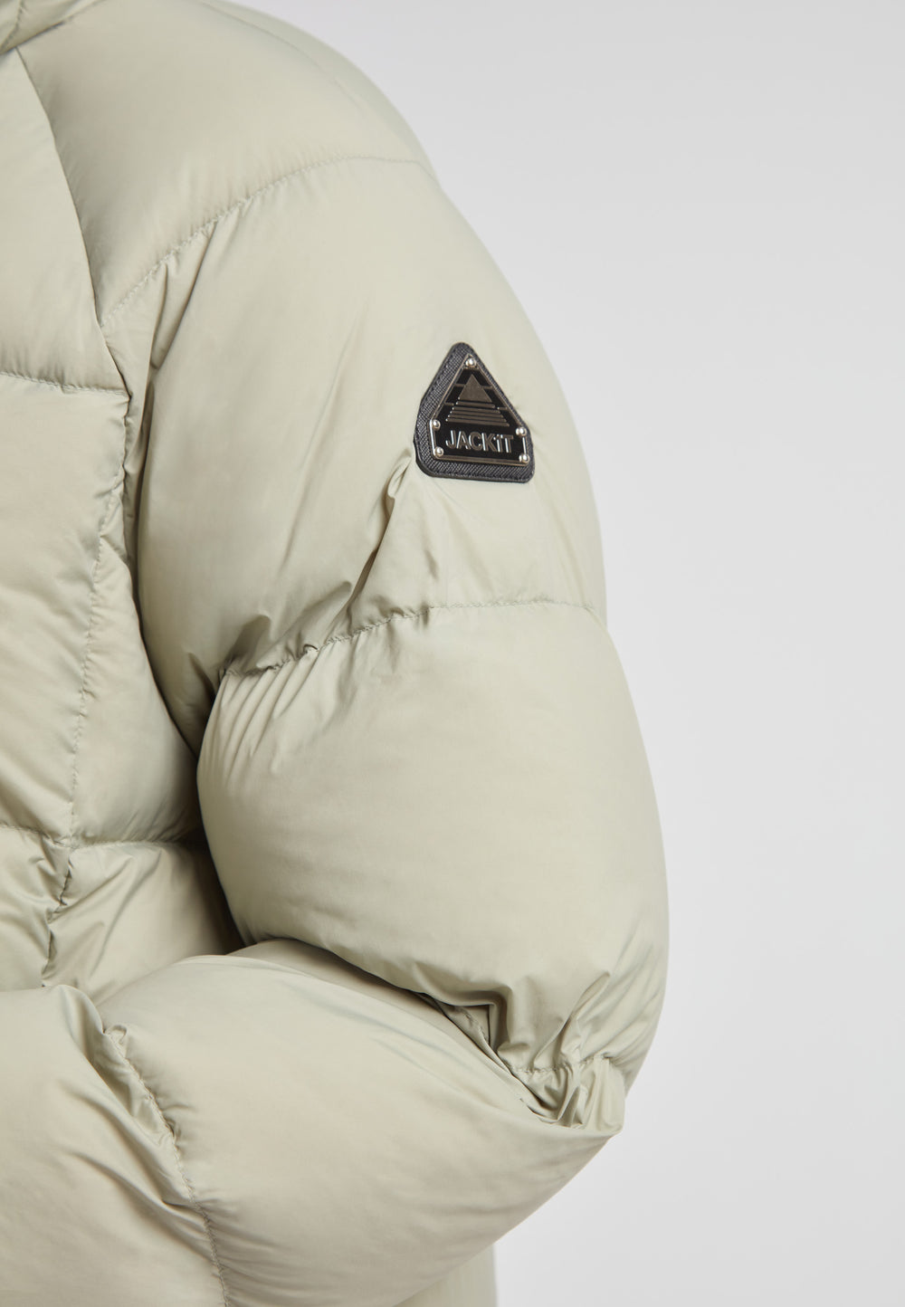 Close-up of the Cloud Ultra Long Down Puffer Coat highlighting the sleeve design and JACK1T logo.