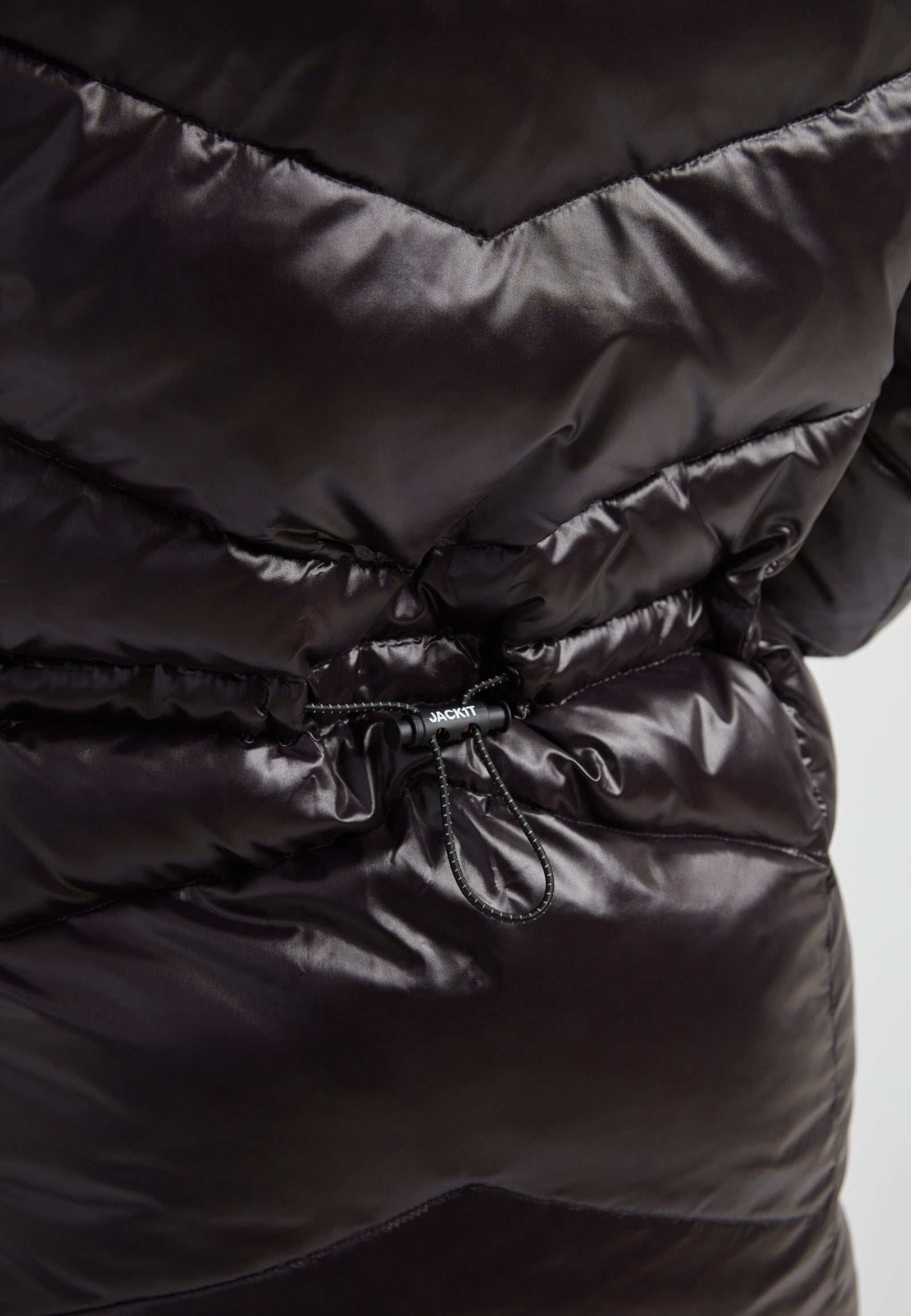 black thigh-length womens slick coat featuring adjustable toggles for a custom fit and sleek water repellent design.