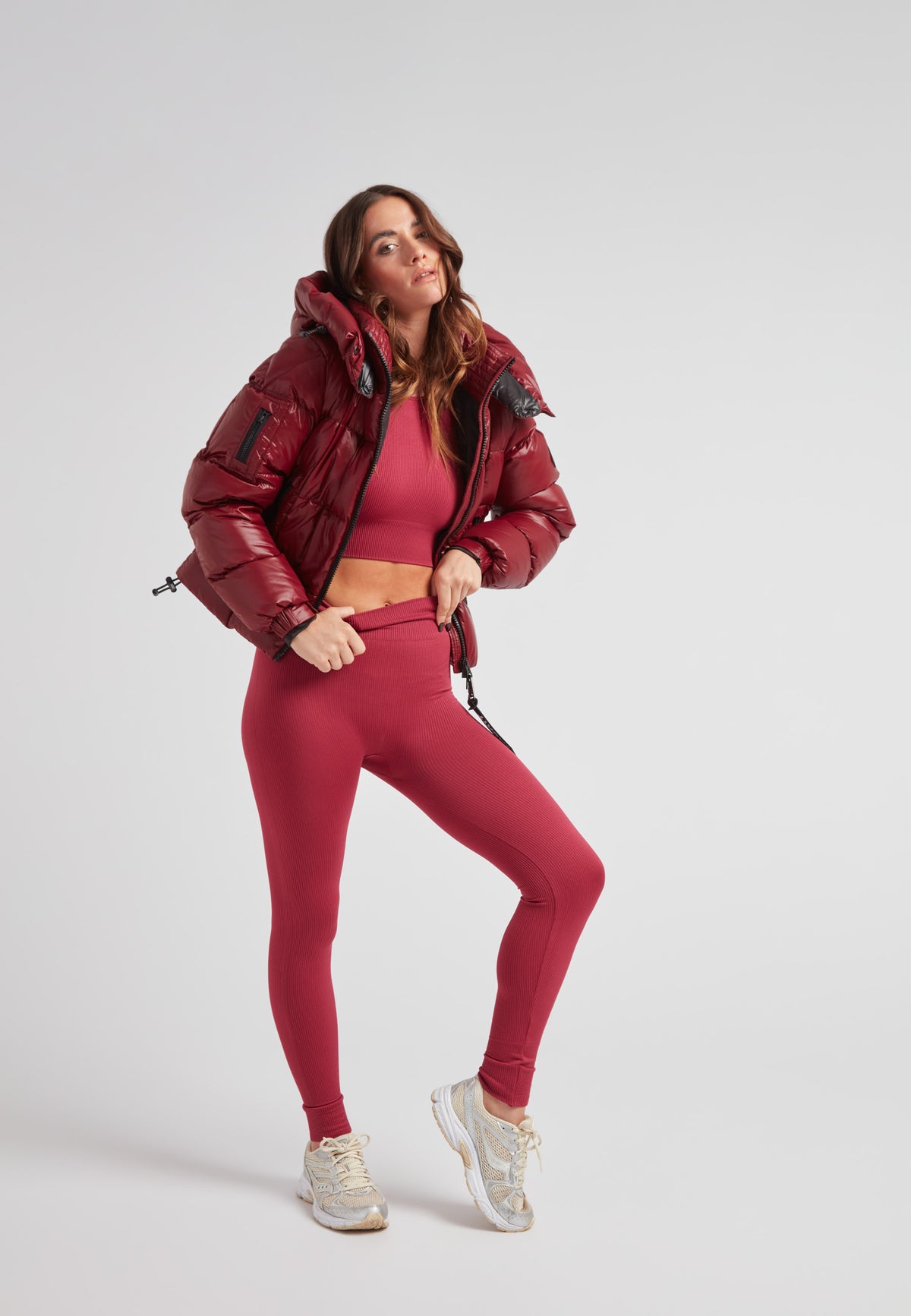 Model wearing EZ Boxed Crop Down Puffer Jacket Lux Cranberry with matching leggings and sneakers.