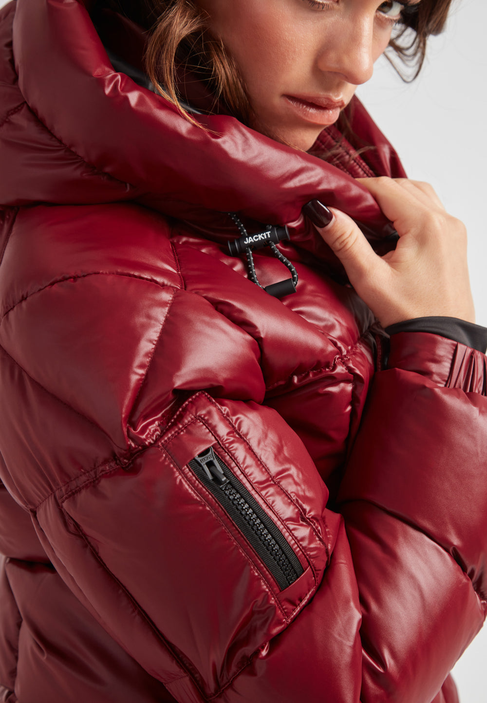 Model wearing the EZ Boxed Crop Down Puffer Jacket Lux Cranberry, showcasing its stylish design and cozy features.