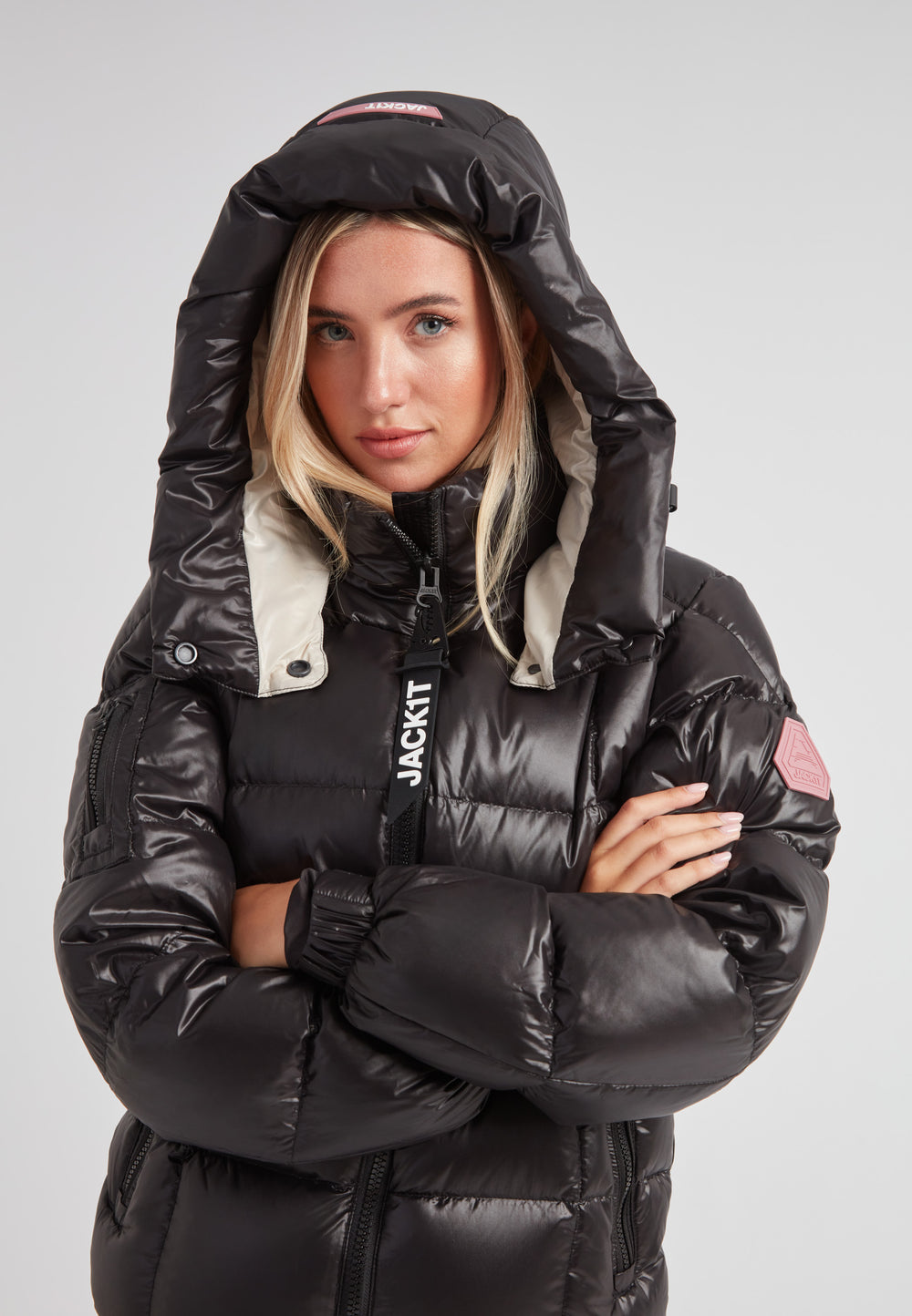 Model wearing the EZ Boxed Racer Down Puffer Jacket Lux Black featuring a hood and sleek design.