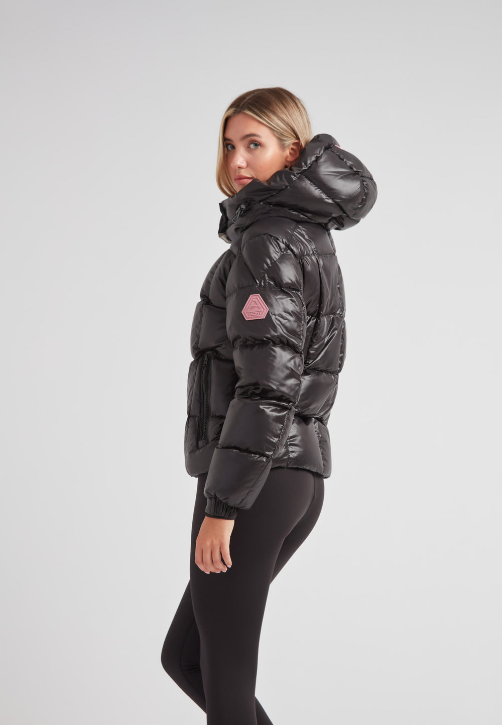 Model wearing EZ Boxed Racer Down Puffer Jacket Lux Black in a stylish side pose, showcasing its sleek design and warmth.