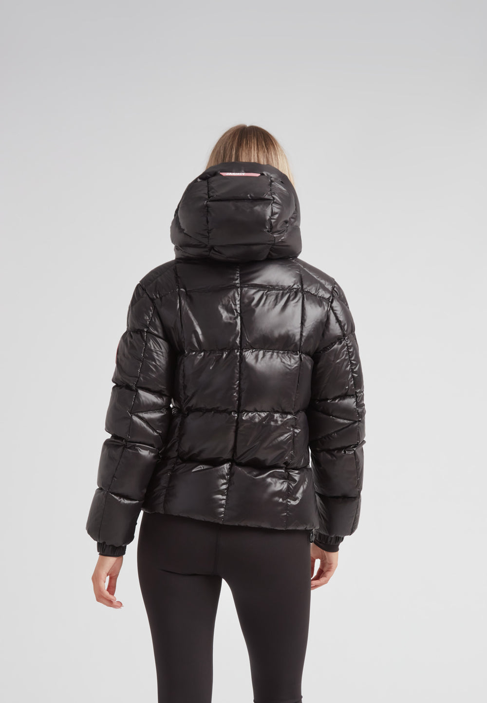 Back view of the EZ Boxed Racer Down Puffer Jacket Lux Black showcasing its modern design and quilted texture.