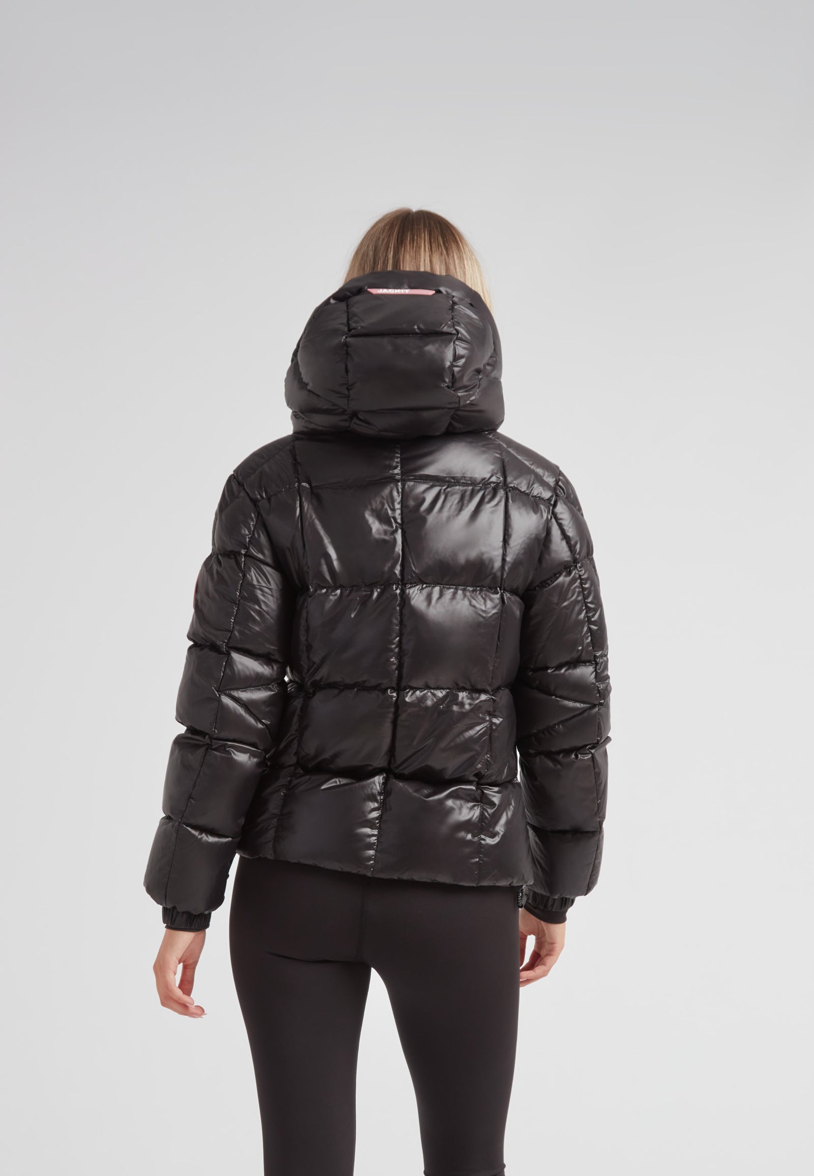 Back view of the EZ Boxed Racer Down Puffer Jacket Lux Black showcasing its modern design and quilted texture.