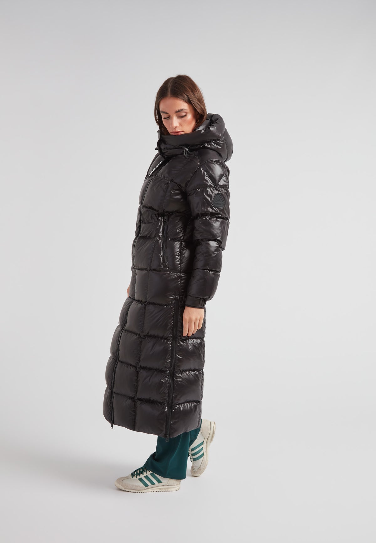 Woman wearing the EZ Boxed Ultra Long Down Puffer Coat Lux Black in a stylish pose.