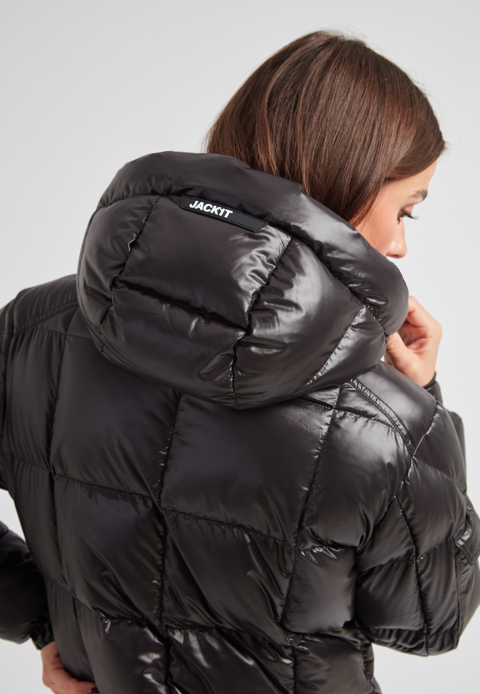 Woman wearing the EZ Boxed Ultra Long Down Puffer Coat Lux Black, showing the back and hood details.