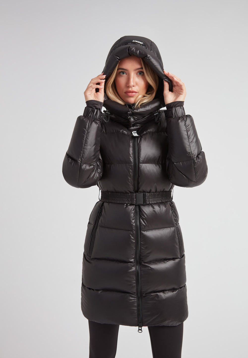EZ Belted Down Puffer Coat Lux Black worn by a model, showcasing its stylish design and warm insulation.