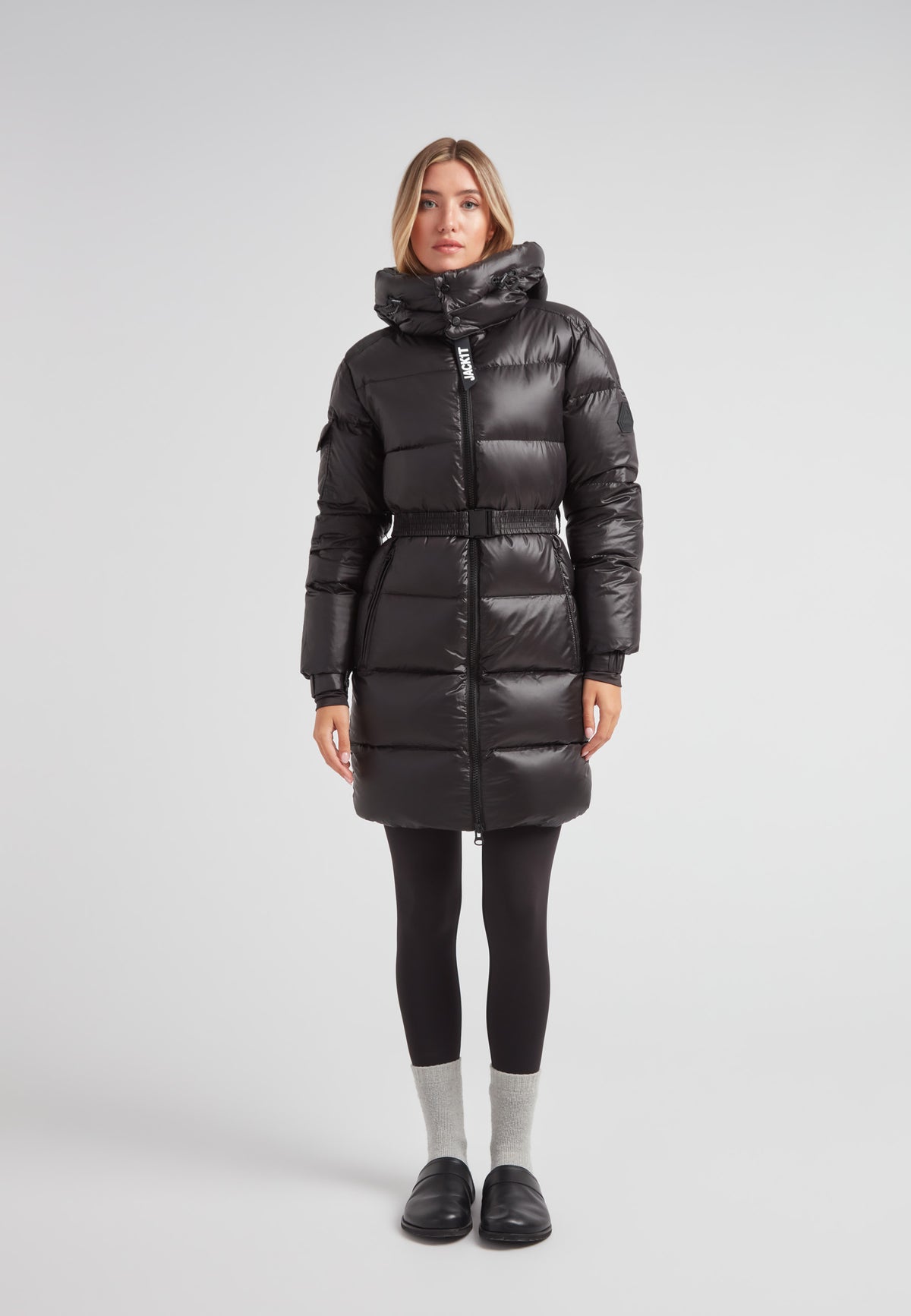 Model wearing EZ Belted Down Puffer Coat Lux Black, showcasing its sleek design and full-length warmth.