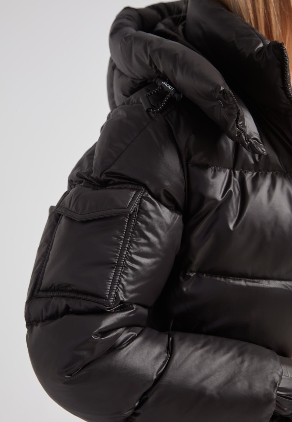 Close-up of EZ Belted Down Puffer Coat Lux Black showcasing the sleek design and shiny fabric detail.