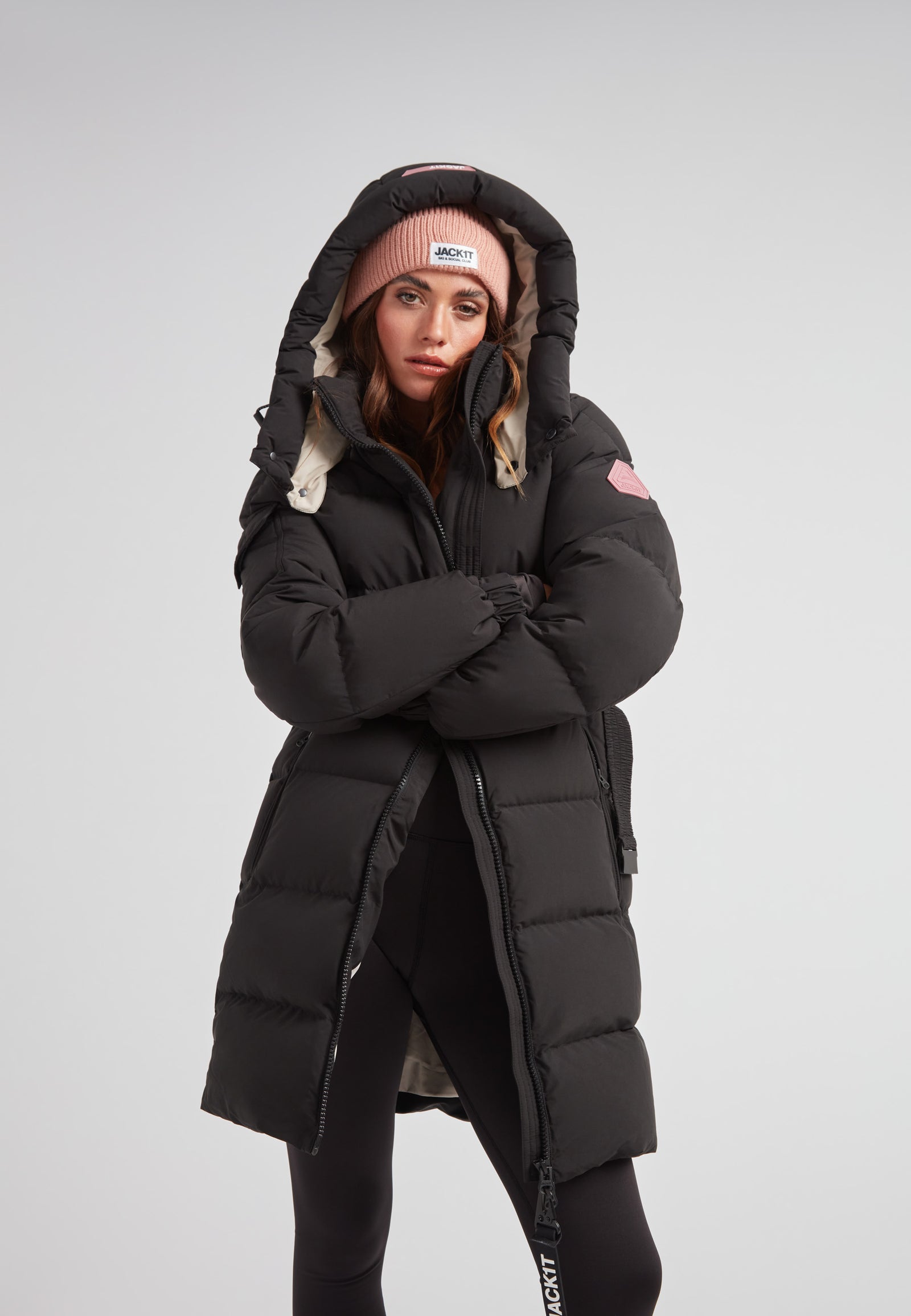 Model wearing the EZ Belted Down Puffer Coat Matt Black with hood and stylish accessories.