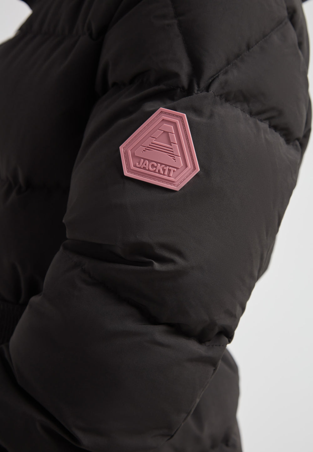 EZ Belted Down Puffer Coat Matt Black showing shoulder detail with pink emblem.