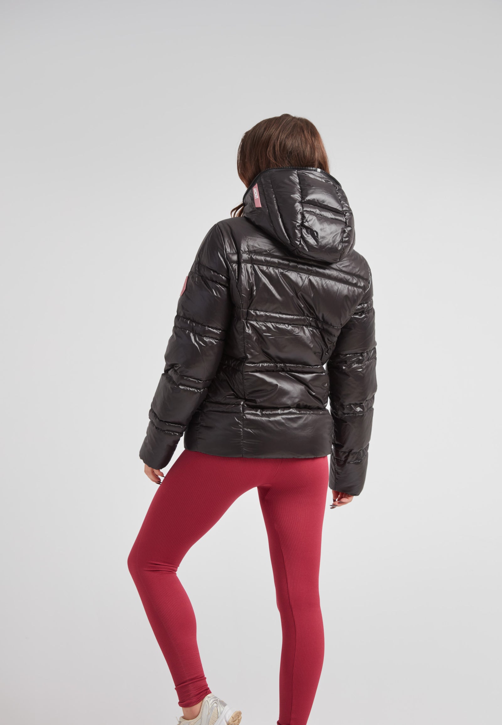 R4D Tramline Puffer Racer Jacket Lux Black displayed on model from the back, showcasing its sleek black design.