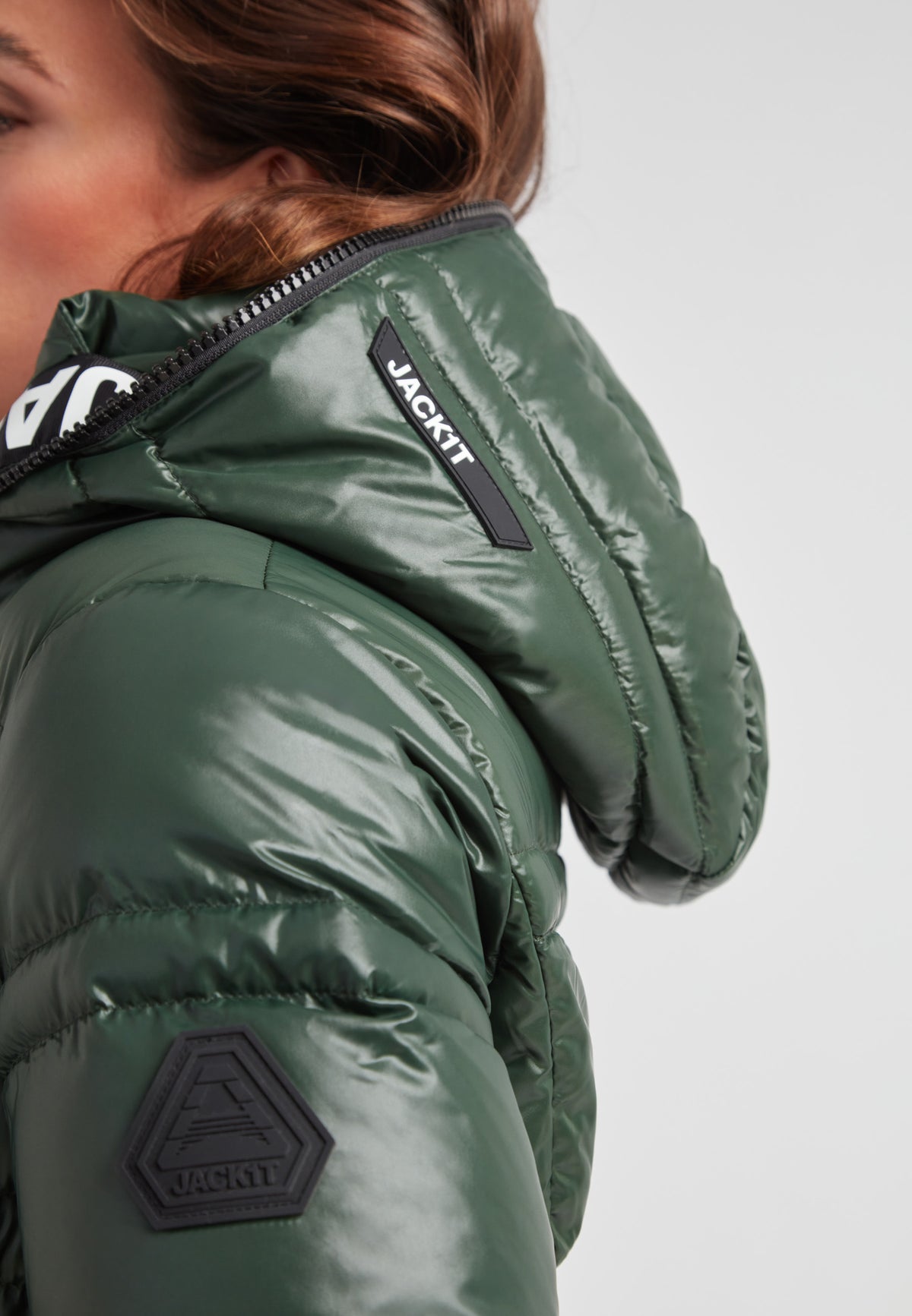 R4D Tramline Puffer Racer Jacket Lux Emerald close-up showing hood and logo detail.