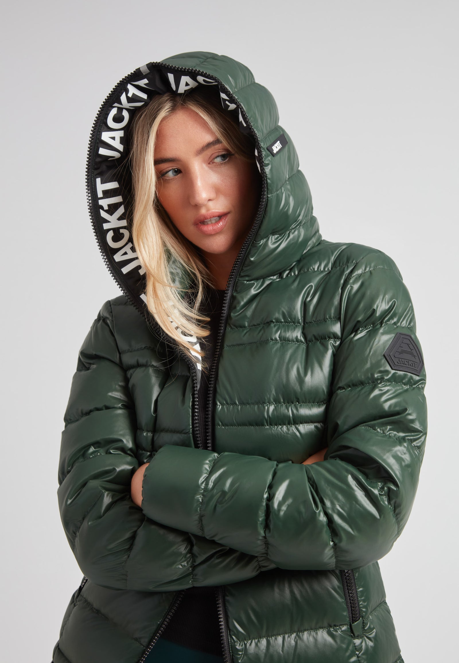 R4D Tramline Down Coat Lux Emerald model showcasing its stylish design and functional hood.