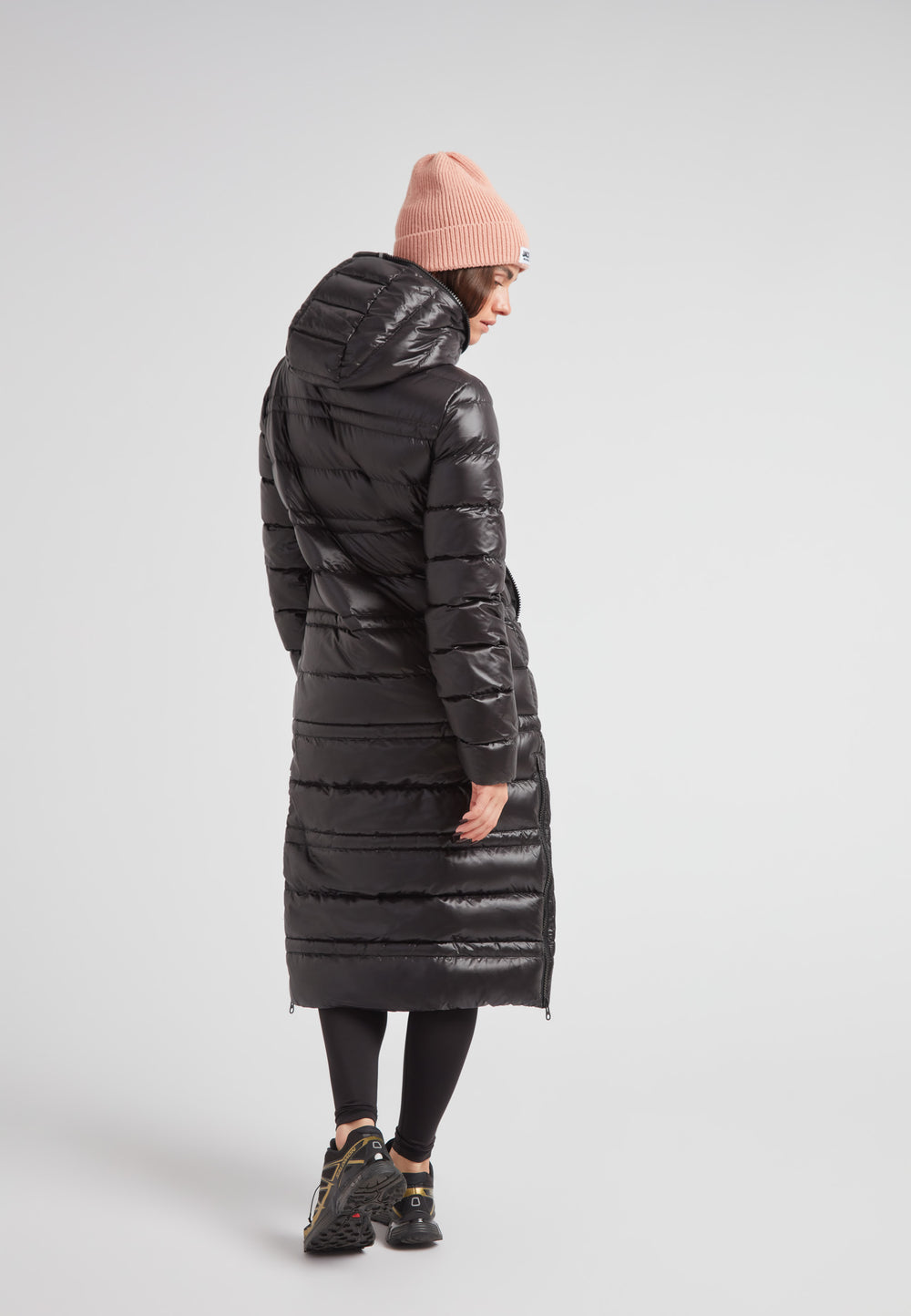 R4D Tramline Extra Long Down Coat Lux Black seen from the back, showcasing its sleek design and full-length fit.